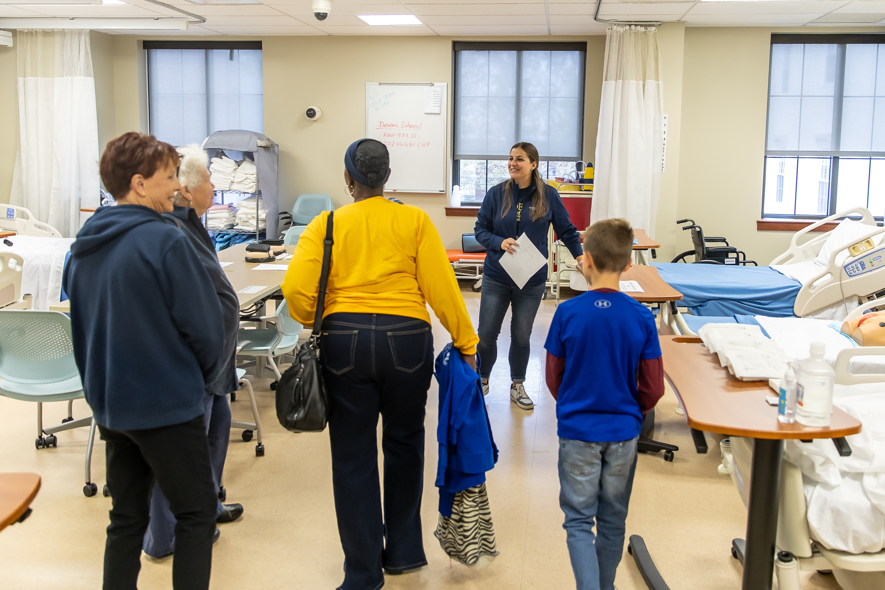 Alumni take a tour in the nursing simulation center.