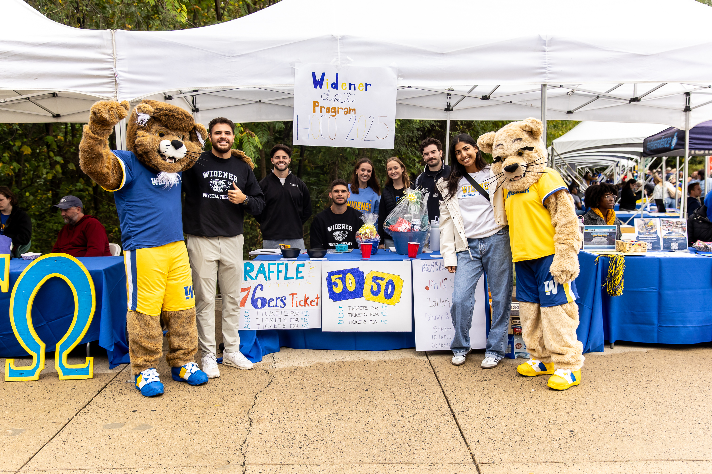 Students in the graduate physical therapy program pose with the mascots.