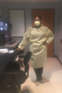 Tamica Johnson poses at work in medical protection equipment.
