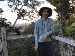 Student standing in the rainforest in Peru