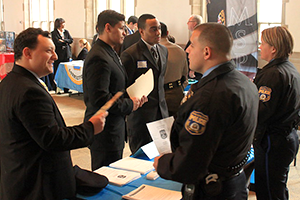 Students network with law enforcement officers during Widener's criminal justice career fair.