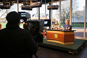 Student filming Widener student news broadcast
