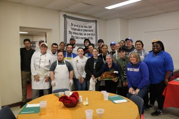Students prepare a meal at the Salvation Army for Thanksgiving