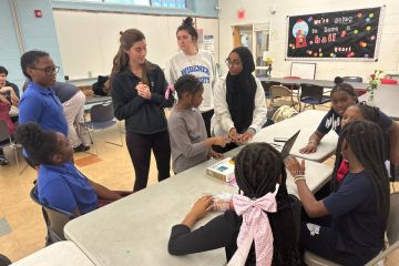 Kayleigh Armstrong and her teammates work with young students at the Boys and Girls Club of Chester.