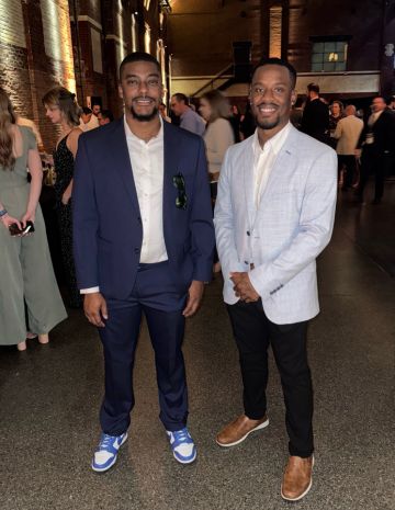 Andrew Proctor and Dakarai Daniel pose together for a photo