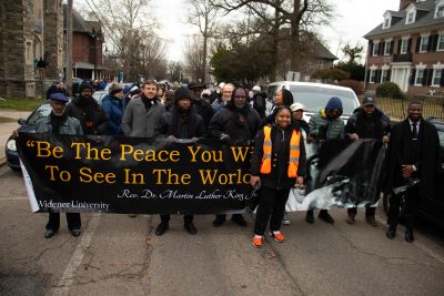 Individuals lead the peace march during the MLK Day of Service event.