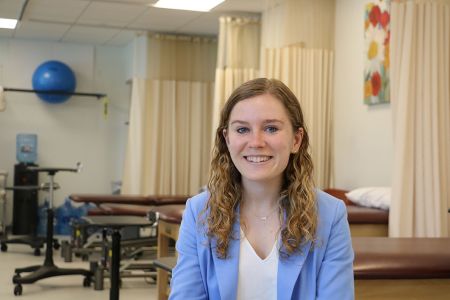 Alex Polón sitting in the Chester Community Clinic