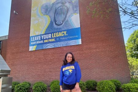 Belle Nicholas Kapelski banner 960 x 640 Belle Nicholas poses in front a mural on Widener's campus that reads "Leave Your Legacy."