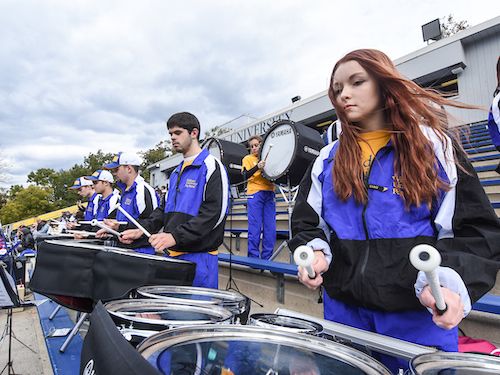 band students play drums at homecoming